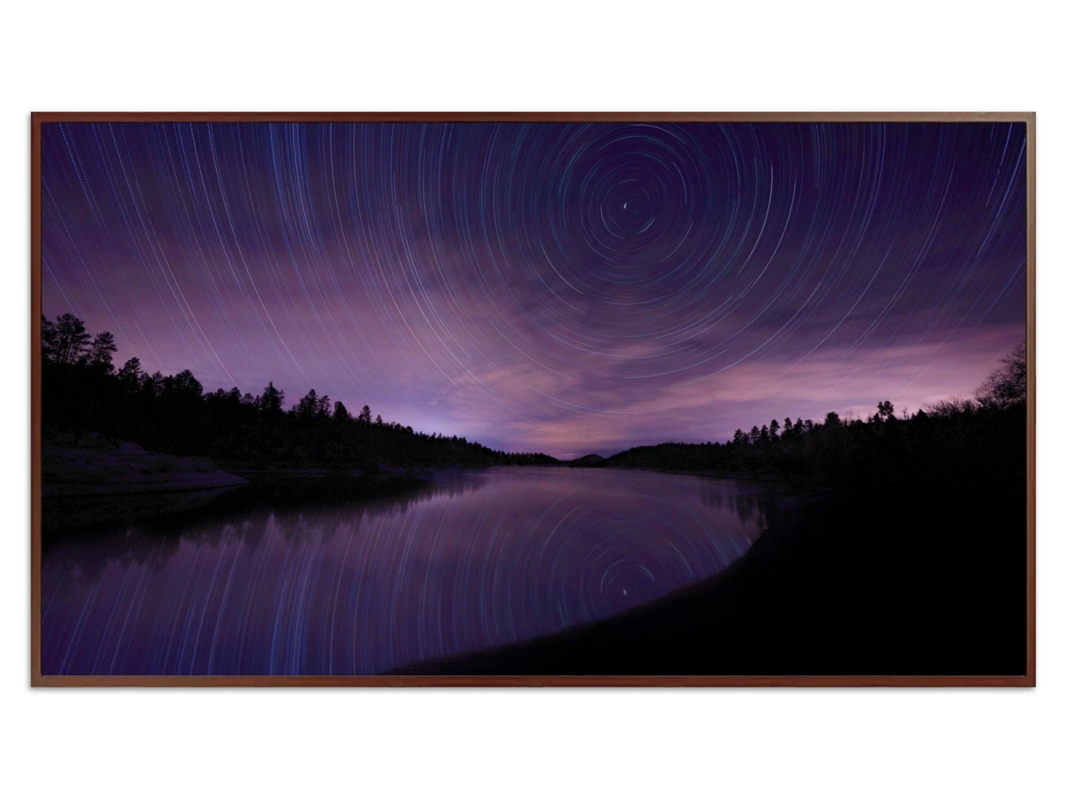 Lake surrounded by trees with star trails - Free art for Frame TV