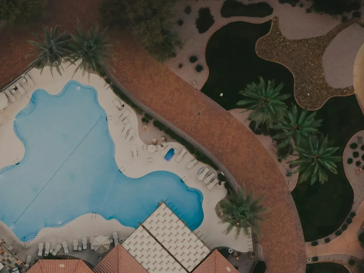 Aerial view of a building with a pool - Ideal for Canvas TV - Enhance your decor with free art